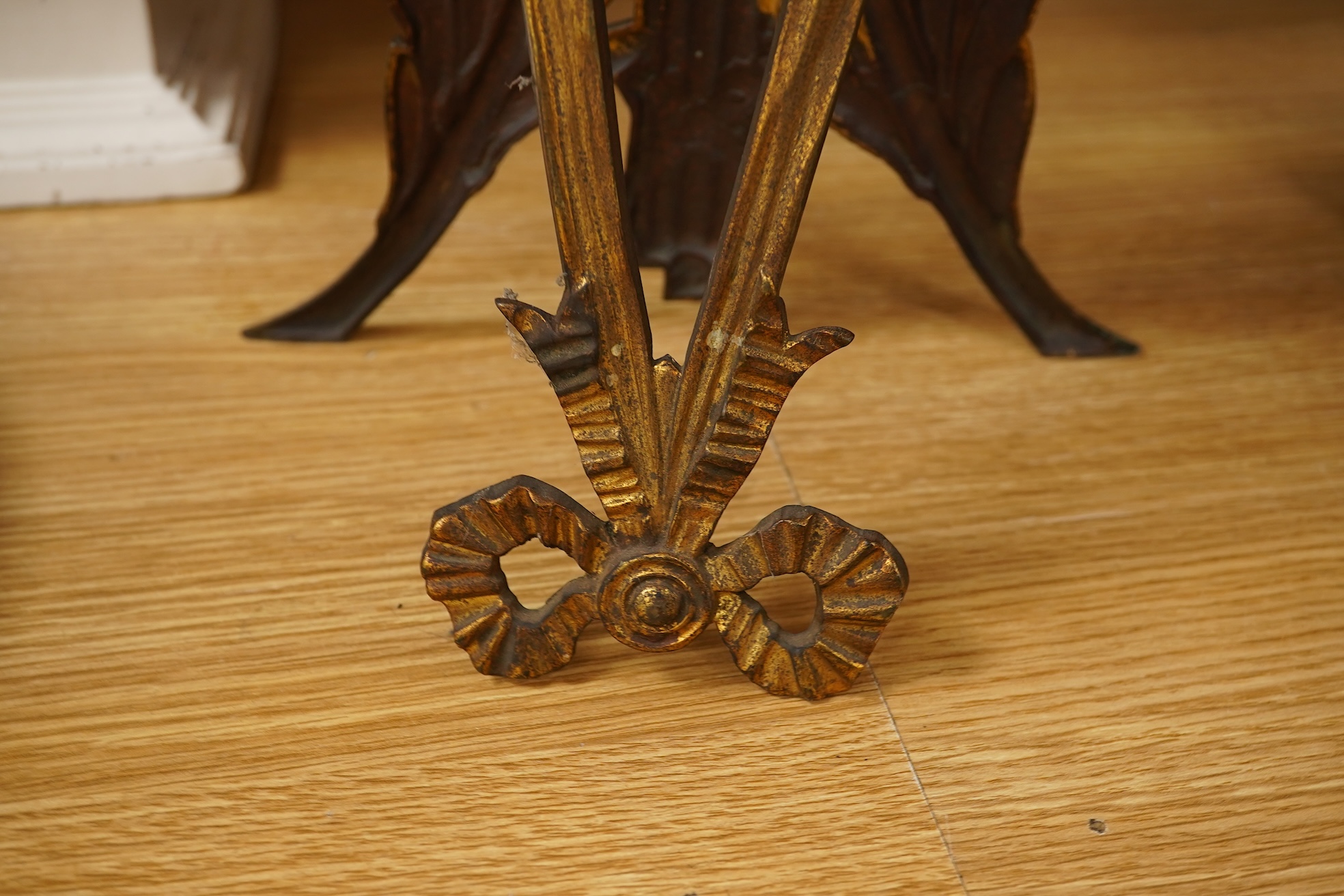 A Regency ebonised and brass inlaid lancet-shape bracket clock, with key and a painted pottery strut timepiece, largest 55cm high (2)